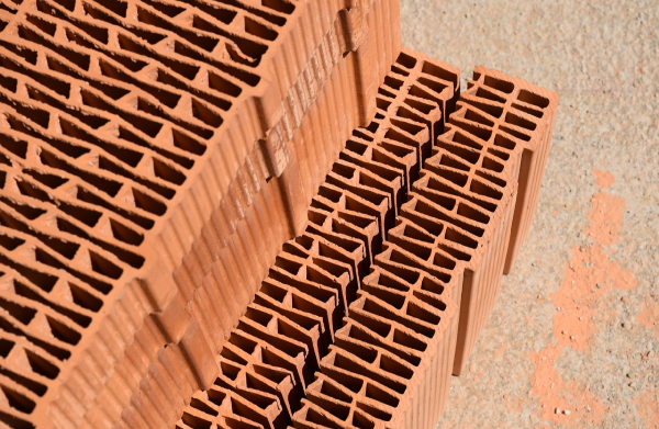 Raw material, stack of bricks for construction